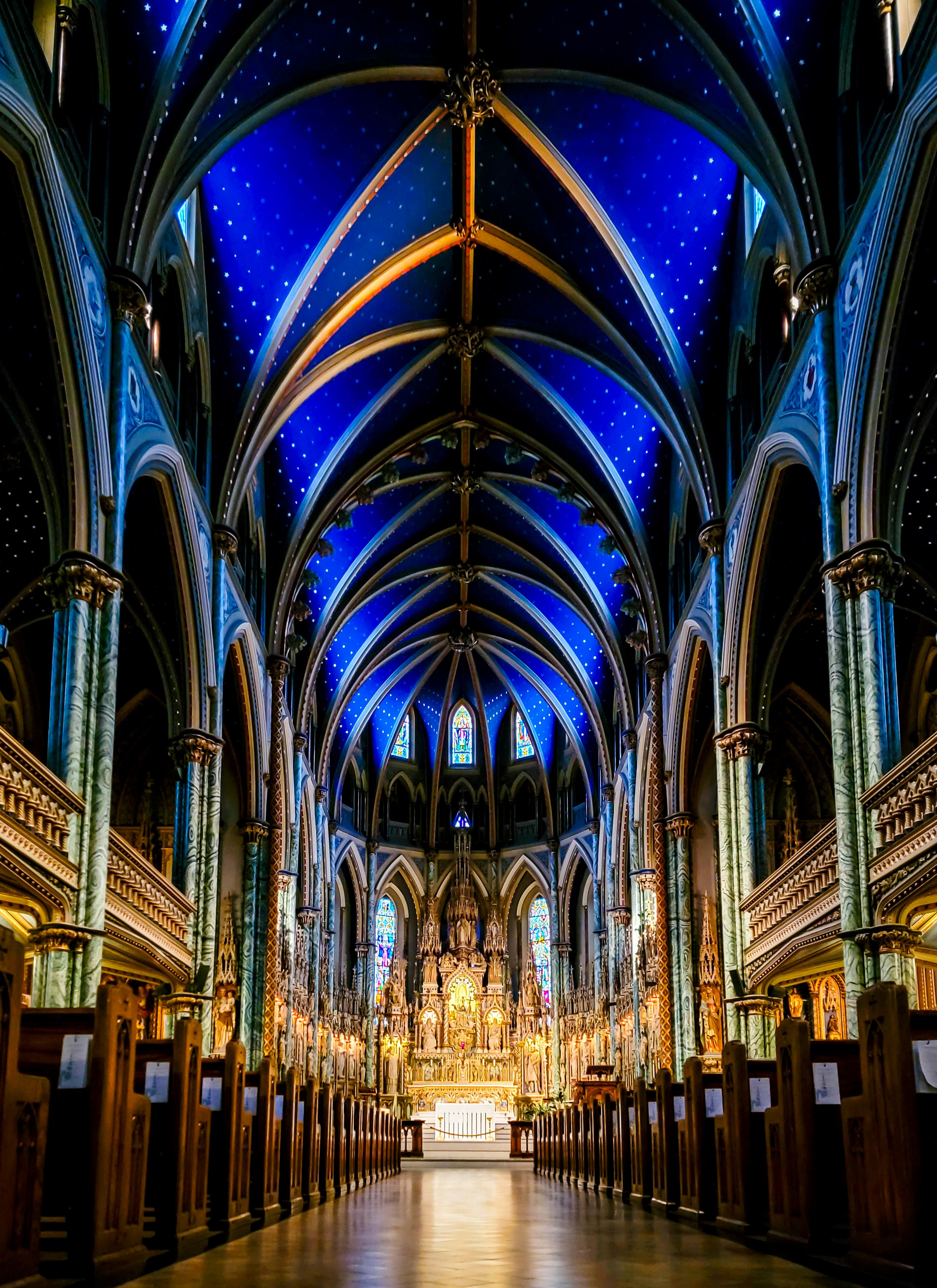 Blue, star-covered vaulted ceiling inside a historic church
