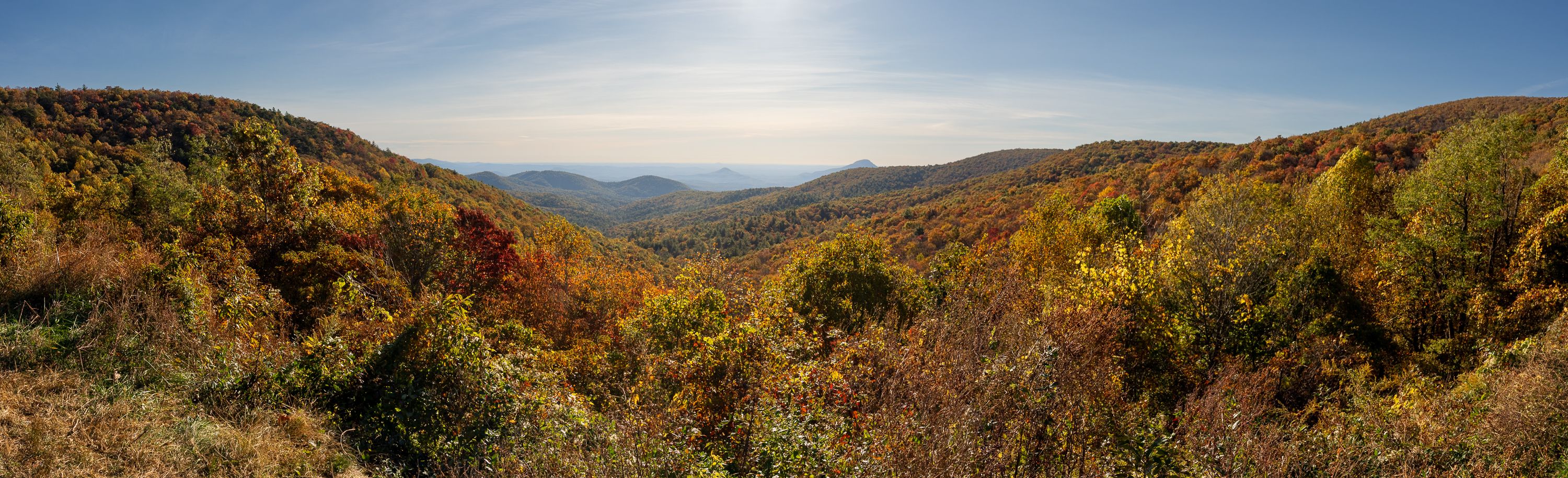 Panoramic autumn landscape across a mountain valley